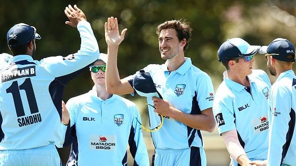 Starc celebrates a wicket NSW