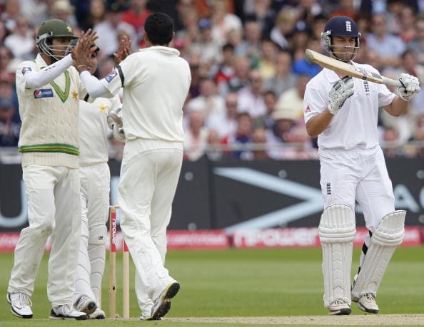 Jonathan Trott (R) of England signals fo