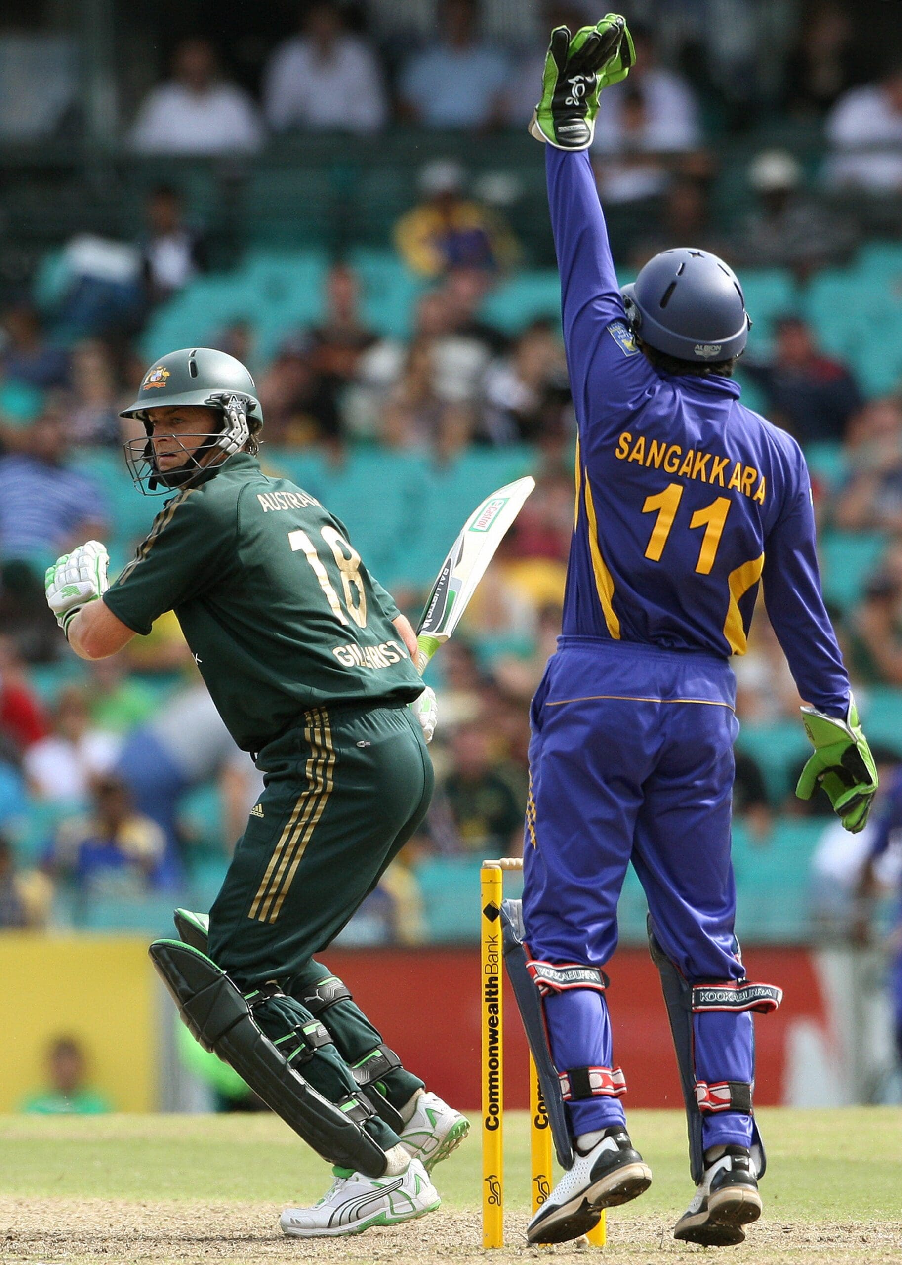 Australia’s Adam Gilchrist (L) looks aro