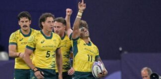 Australia’s rugby seven players celebrate after winning the quarter-final rugby against the USA. Credit: Getty Images