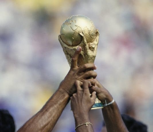 Brazil footballers celebrate with the FIFA World Cup trophy following the World Cup final between Brazil and Italy, at the Rose Bowl in Pasadena, California, 17th July 1994. Brazil won the match on penalties after the game ended 0-0 after extra time. (Photo by Henri Szwarc/Bongarts/Getty Images)